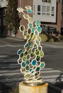 Fossil II, vibrant glass and metal hexagon shaped sculpture